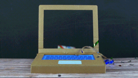 GIF of someone receiving a gift through a computer