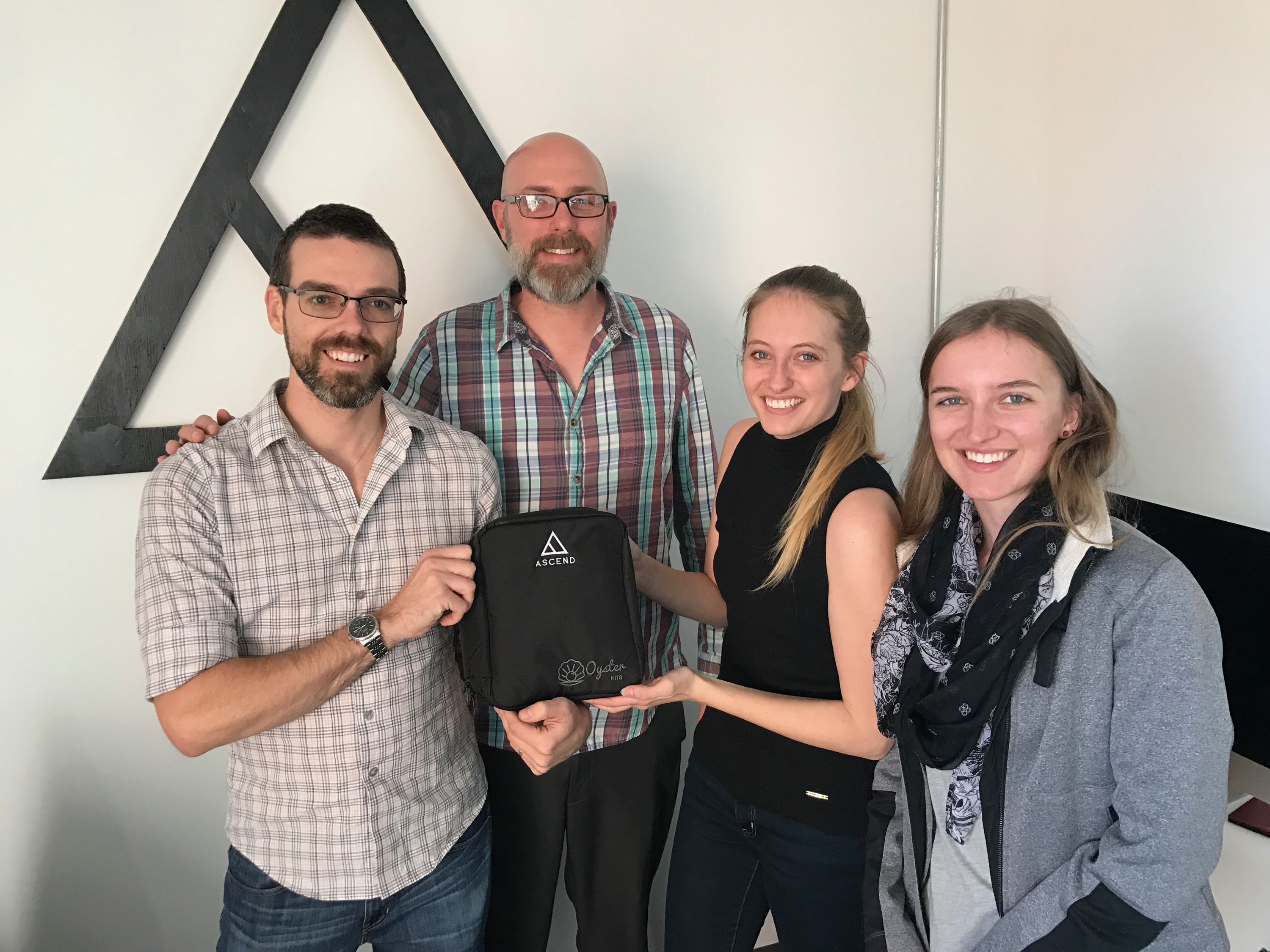 Ascend team holding oyster kit