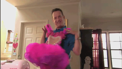 tom hanks holding up a tutu dress