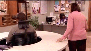ron swanson spinning in chair to avoid talking to a lady