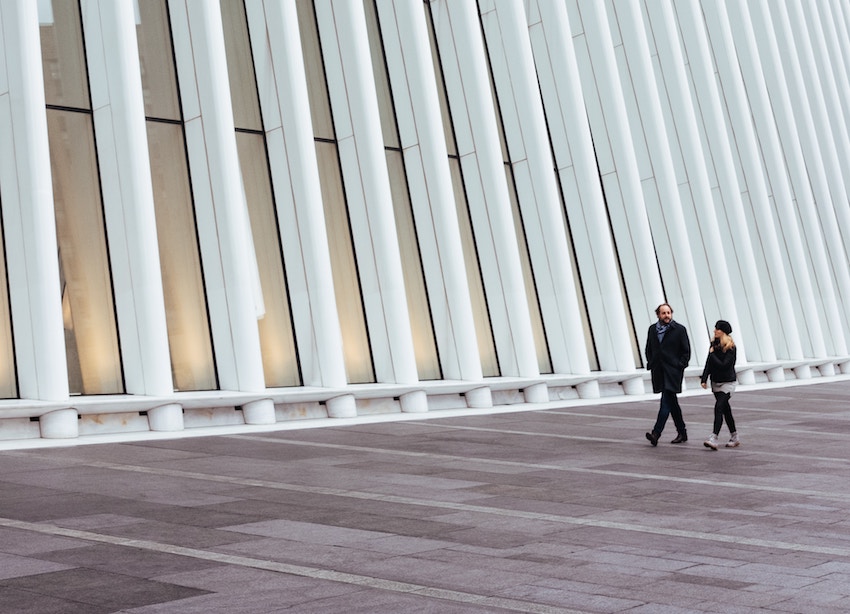 man and woman doing a walking meeting