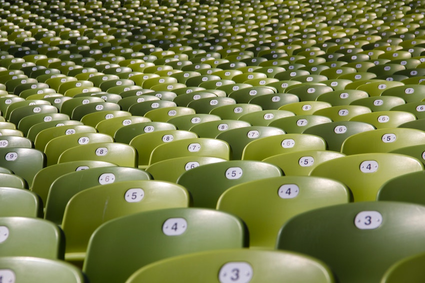 empty rows of chairs with numbers showing