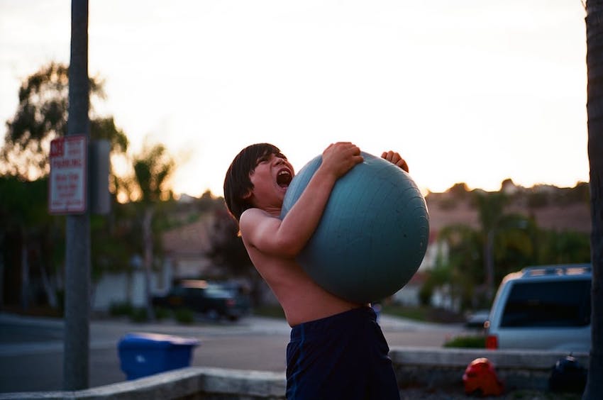 kid holding ball