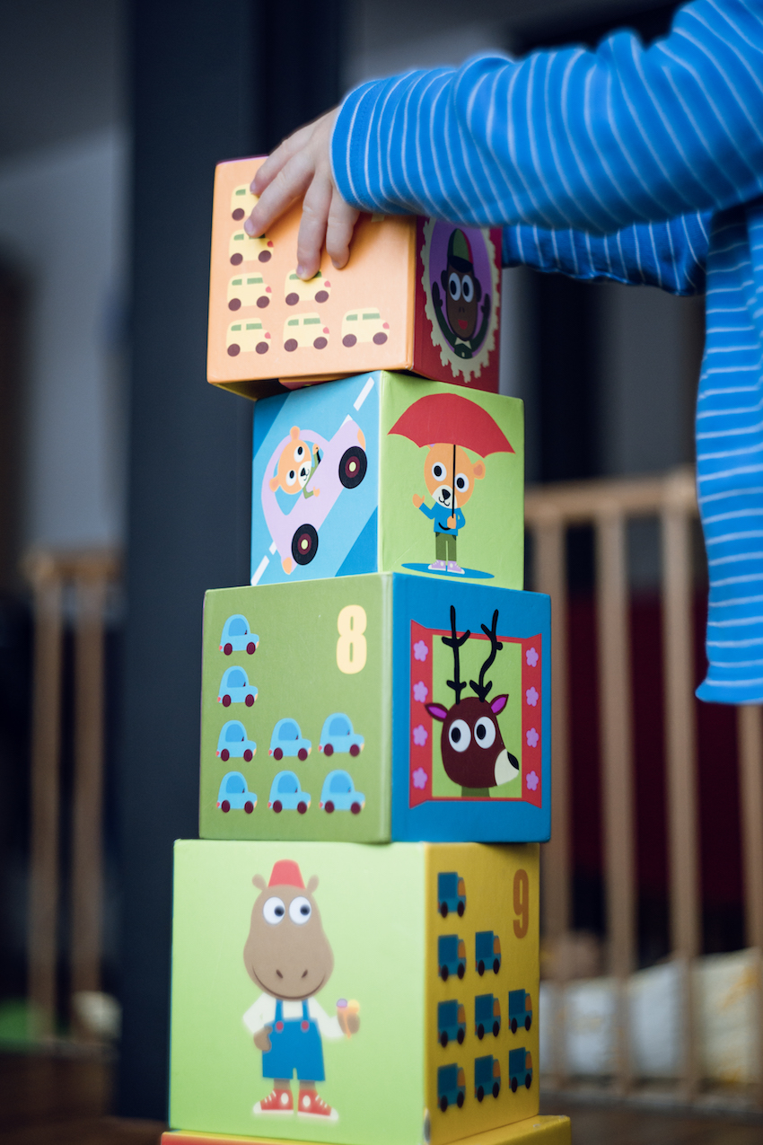 girl stacking blocks