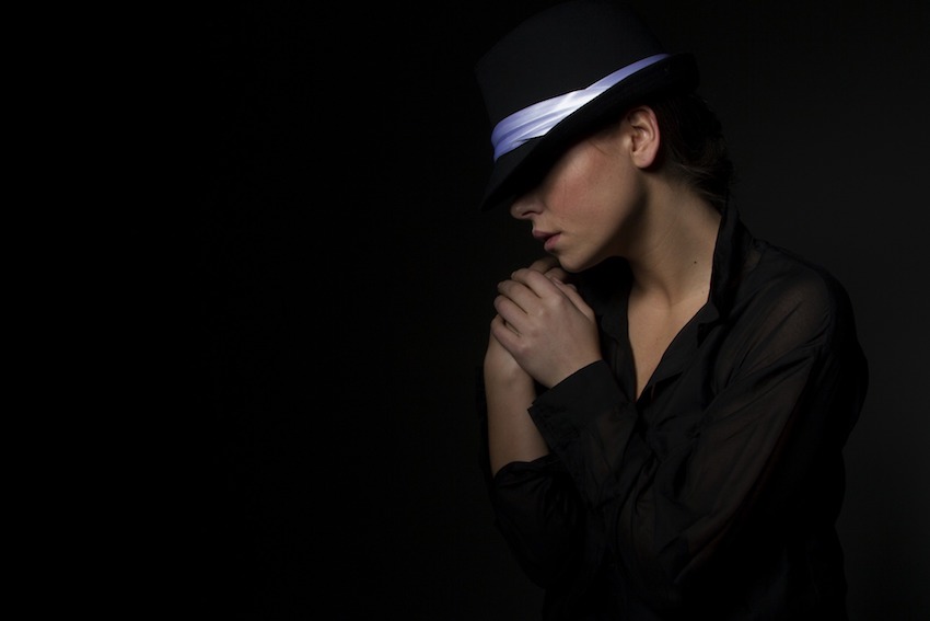 woman wearing black hat