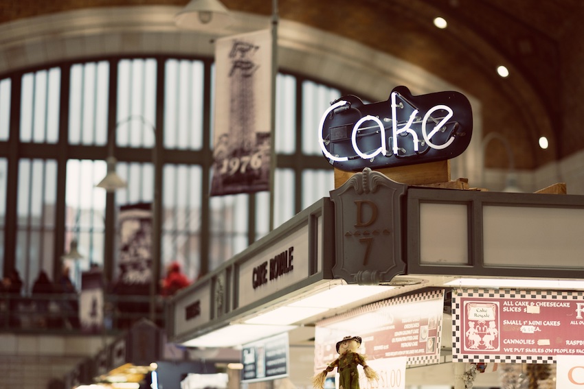 store with cake sign