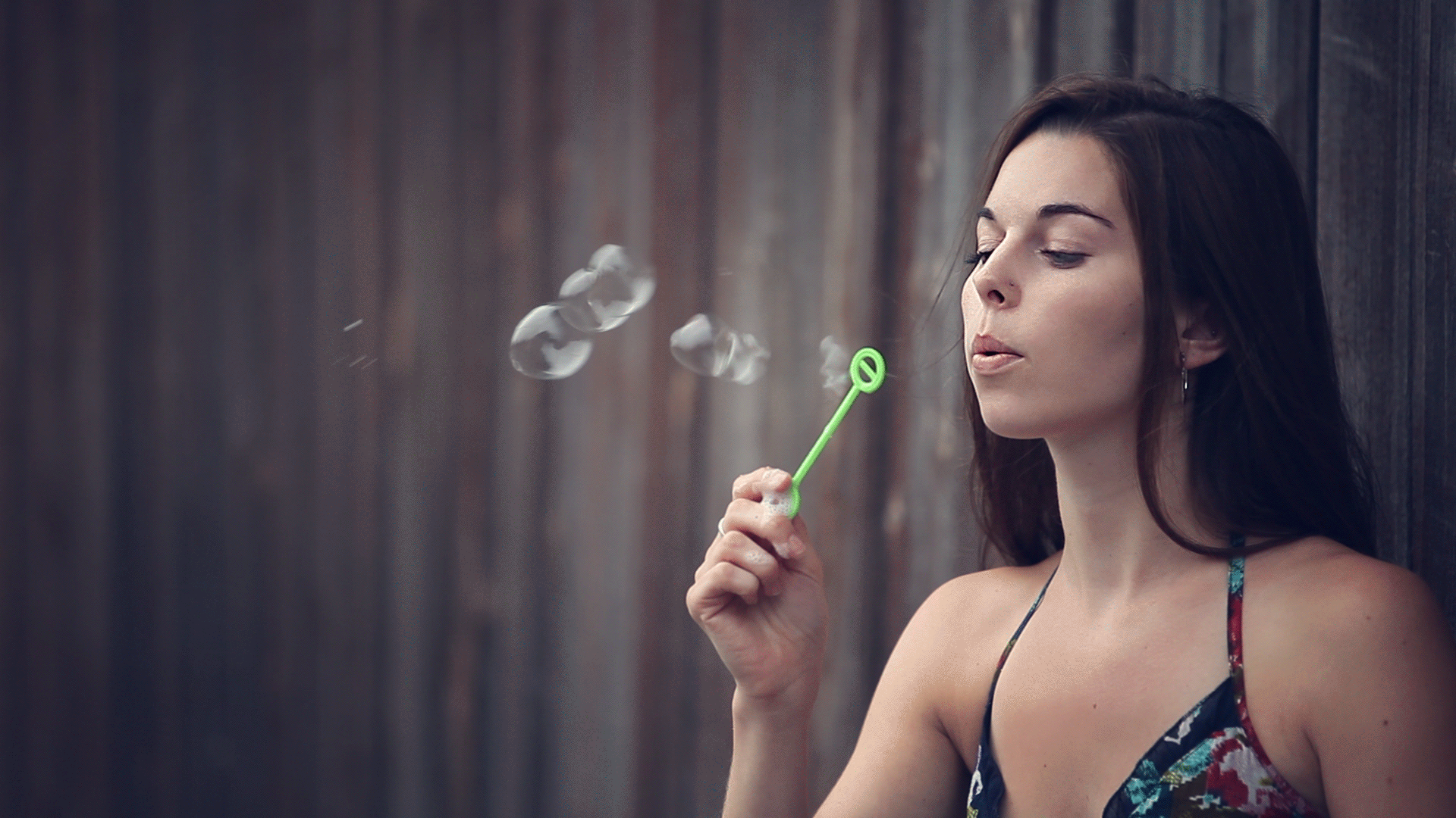 cinemagraph with woman blowing bubbles