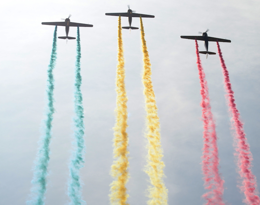 planes launching with colorful trails