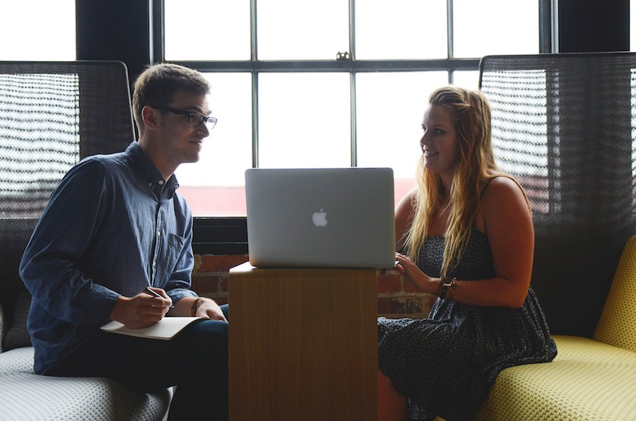 two people working on computer together