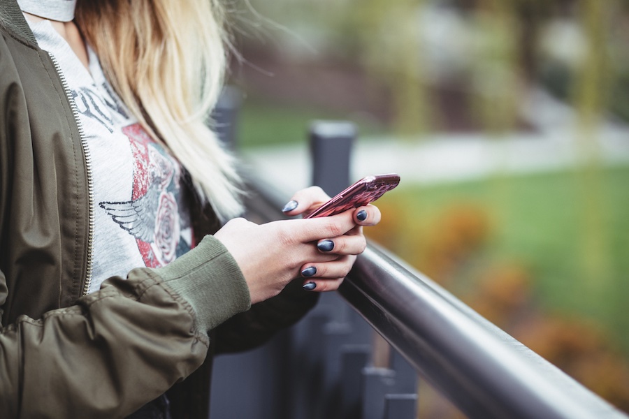 woman browsing on mobile phone