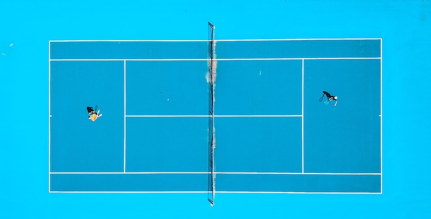 top down photo of a very symmetrical tennis court