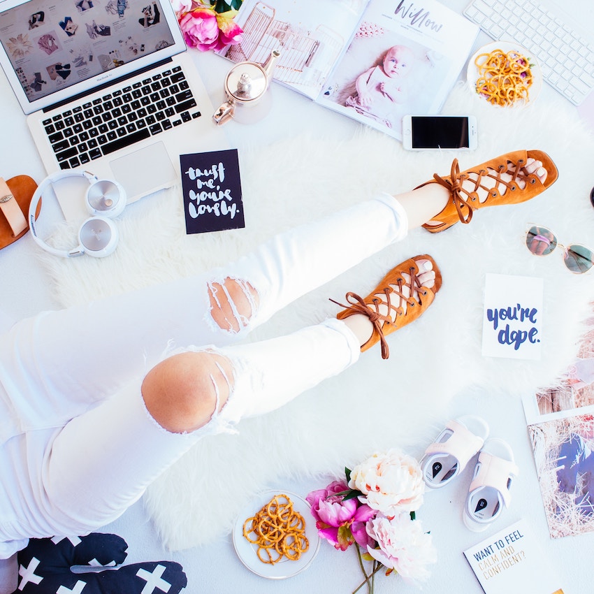 female blogger legs and computer