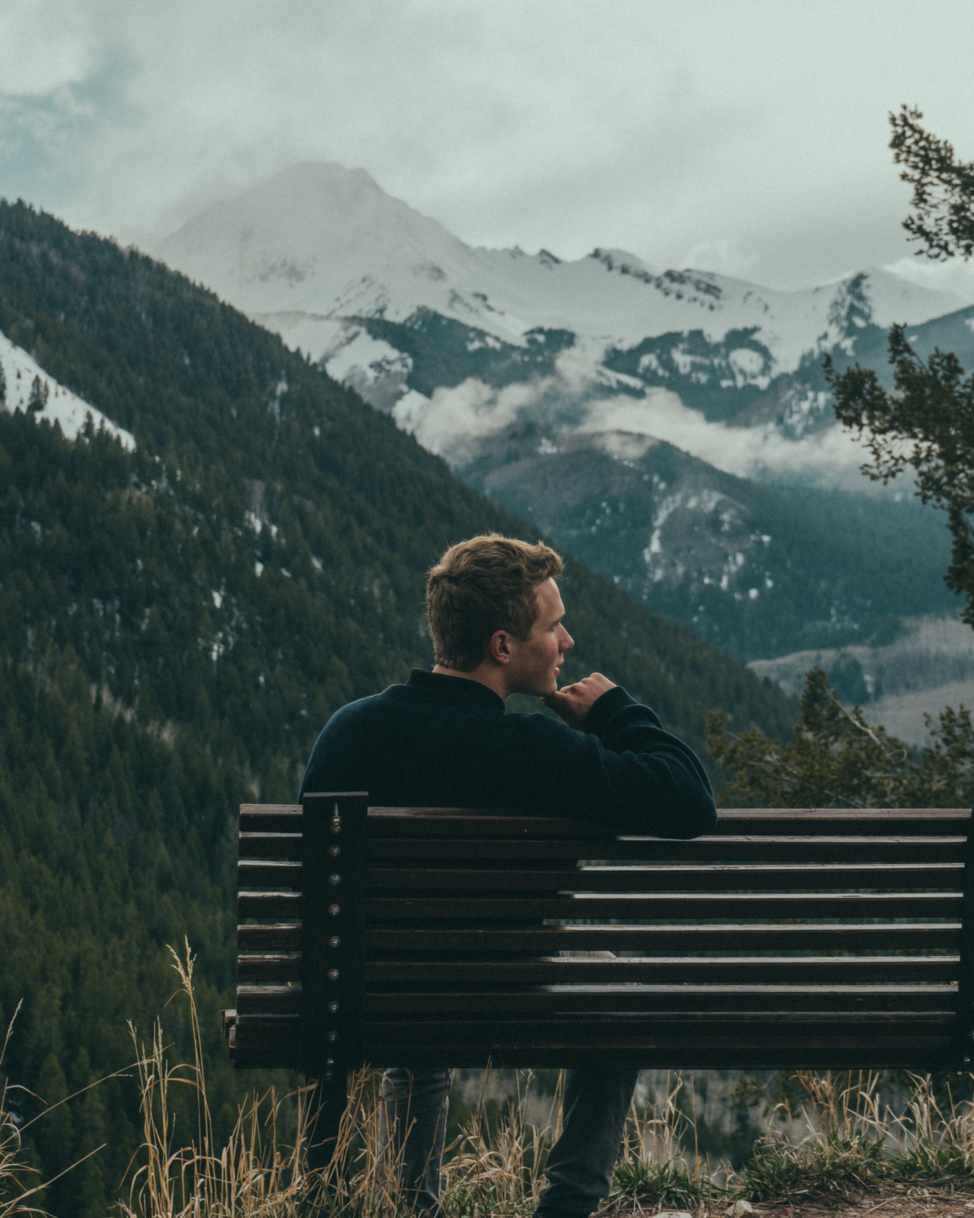 man sitting on bench and thinking