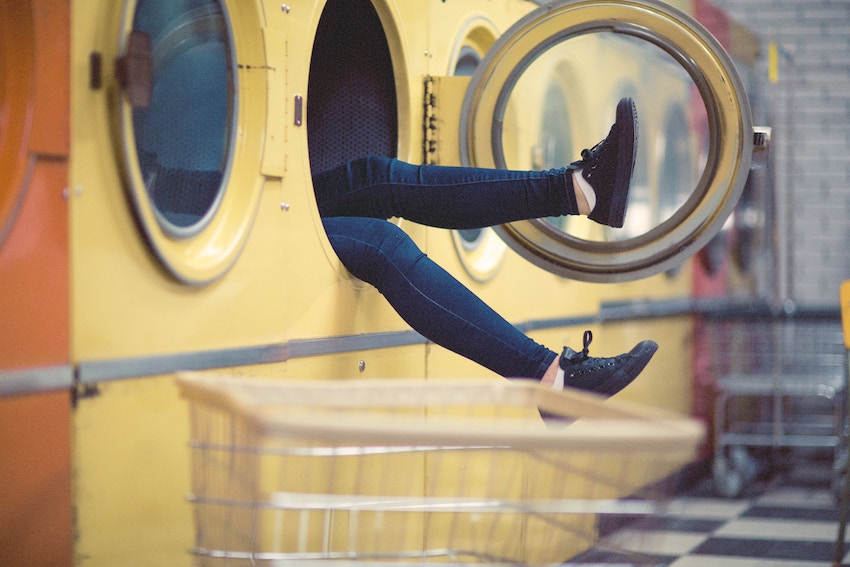 person stuck in a washing machine