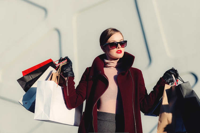 woman carrying shopping bags