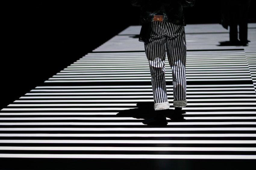 person in stripes on crosswalk