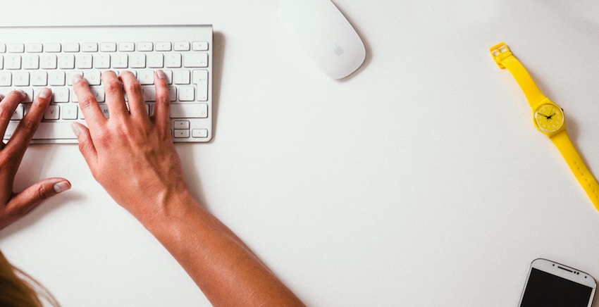 person typing on keyboard