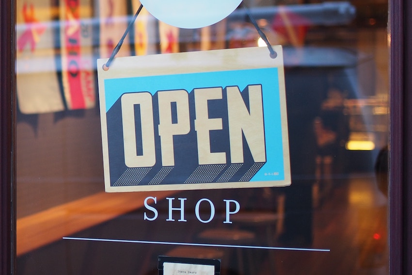 store sign that says open