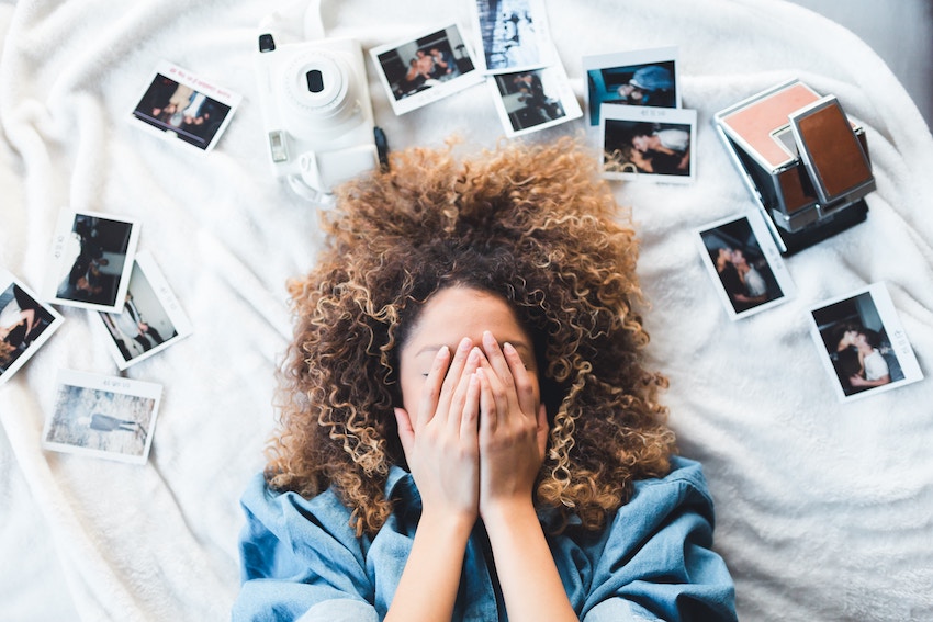 girl with photos around her