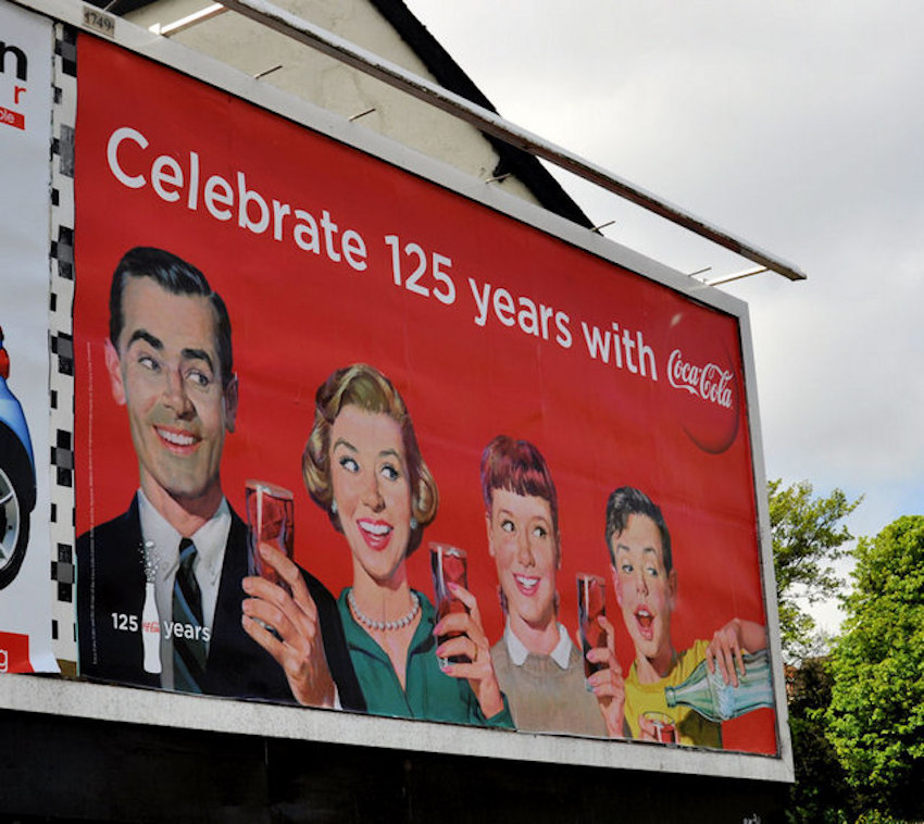 vintage coca-cola billboard ad featuring a family of four to celebrate 125 years of business