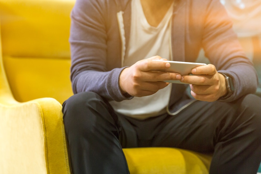 person looking at smartphone