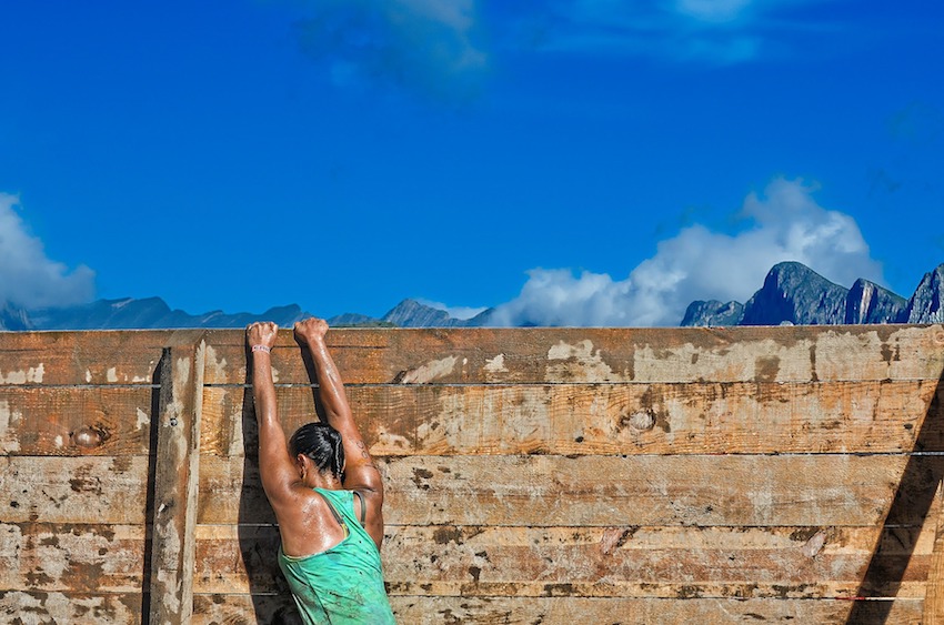 woman climbing wall