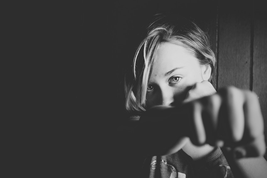 girl throwing a punch